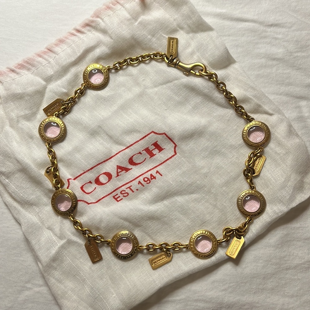 COACH Chainlink Necklace, soft pink Crystal, gold tone hardware, and logo tags.